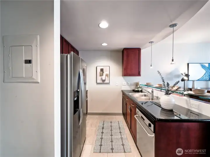 Precision stainless steel appliances and clean lines define a kitchen that is as functional as it is beautiful. This is a staged photo,