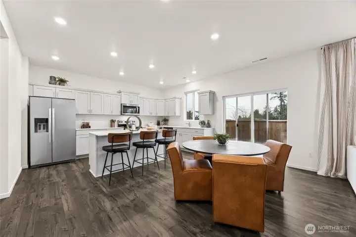 Large kitchen with soft close doors on shaker style cabinets. Photo is representational. Actual home is under construction and colors, materials, and finishes may vary. See site agent for details.