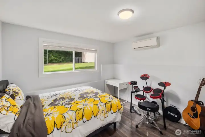 Bright secondary bedroom with mini split comfort and versatile space for work, creativity, or restful nights Bright secondary bedroom with mini split comfort and versatile space for work, creativity, or restful nights