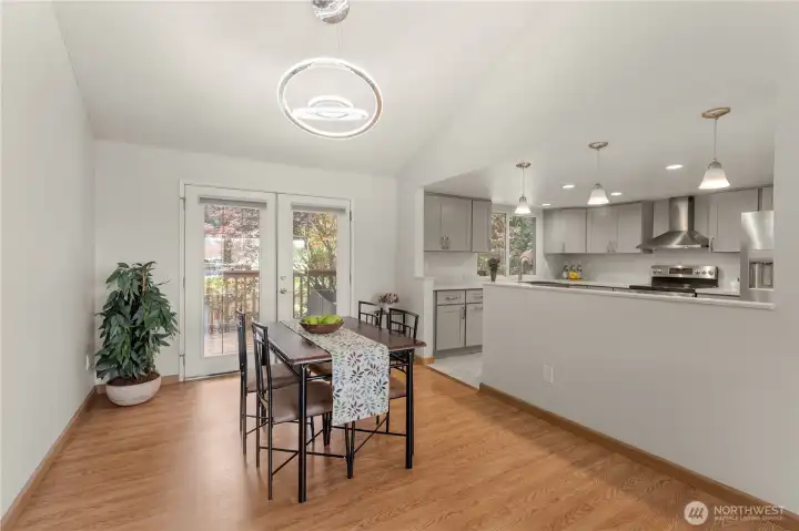 Dining area is large enough for a gathering table. French doors lead to the wood deck. Dining area is large enough for a gathering table. French doors lead to the wood deck.