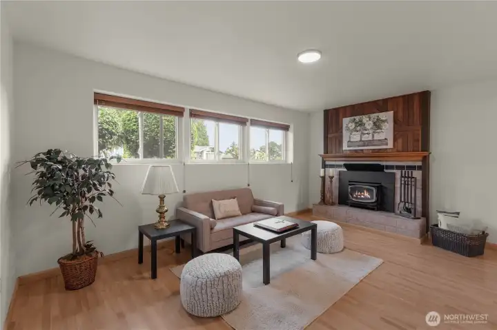 Lower level family room with wood-burning fireplace. Lower level family room with wood-burning fireplace.