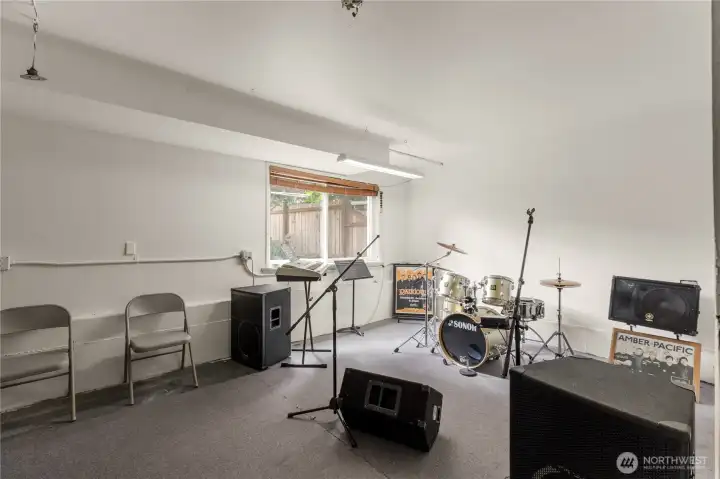 Seller played in a band, and converted some garage space to a band room. Wall could easily be removed to return to garage parking. Seller played in a band, and converted some garage space to a band room. Wall could easily be removed to return to garage parking.