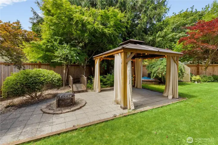 Gazebo and outdoor fireplace both stay! The greenhouse in the distance stays too! Gazebo and outdoor fireplace both stay! The greenhouse in the distance stays too!