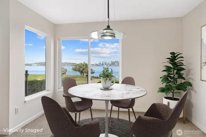 The dining room enjoys an unobstructed, panoramic outlook, beautifully enhanced by the glass panel railing on the view deck, which preserves sightlines and allows the stunning surroundings to take center stage.