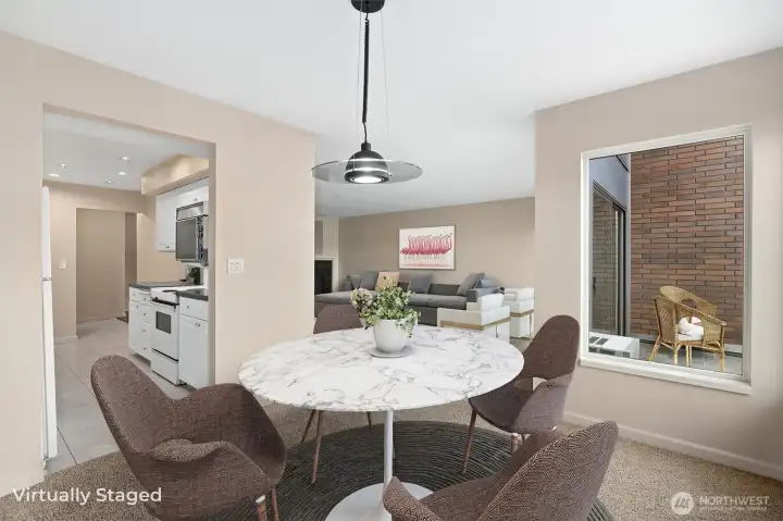 In this photo, the front view deck is visible to the right, while the kitchen is situated to the left, highlighting the home’s thoughtful layout and easy indoor-outdoor flow.
