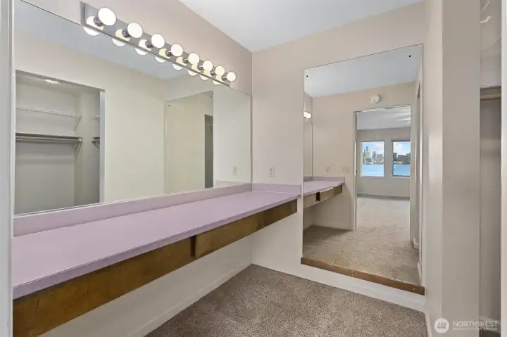 The primary suite’s dressing area offers a well-designed transition space, with the walk-in closet conveniently located to the right for easy access and ample storage.