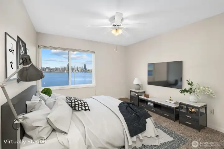 The second bedroom is generously sized and features sweeping views, creating a bright and inviting space.