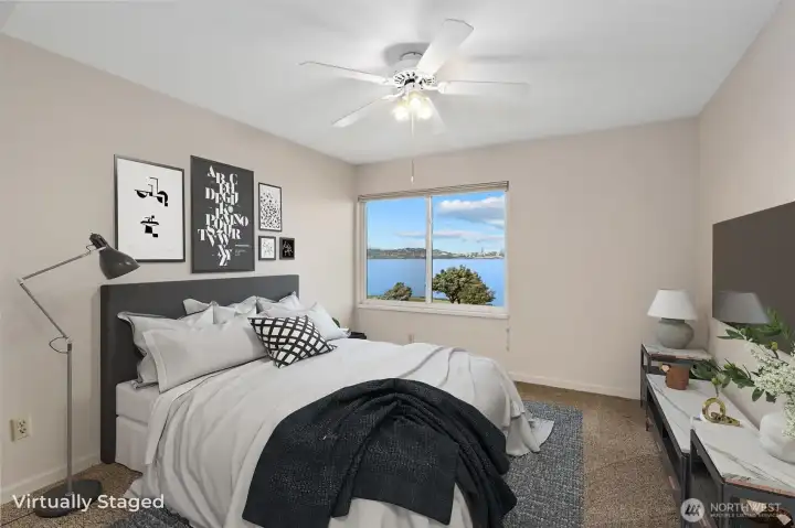 The second bedroom is generously sized and features sweeping views, creating a bright and inviting space.