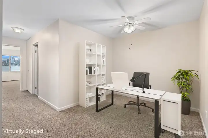 Upstairs, a versatile bonus space offers the perfect opportunity for a home office, reading nook, or a cozy sitting area with a pair of comfortable chairs.
