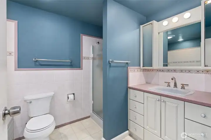 The upstairs full bathroom is thoughtfully designed with a separate shower and bathtub, offering both convenience and comfort for everyday living or a relaxing soak at the end of the day.