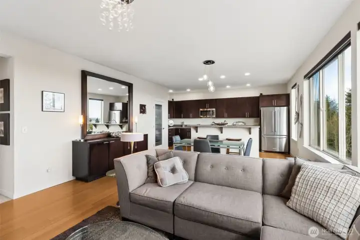 Looking from the fireplace wall, you can see the open feel of the living space from living room to dining to kitchen. No one will be left out of the fun.