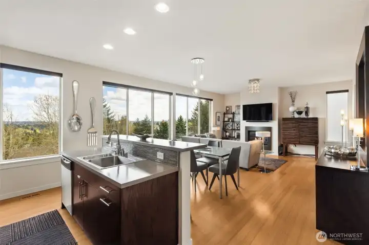 So airy, and such a smart design to this space. Kitchen sink and dishwasher are in the island, so even when you are doing dishes you can be enjoying your view or watching the tv.