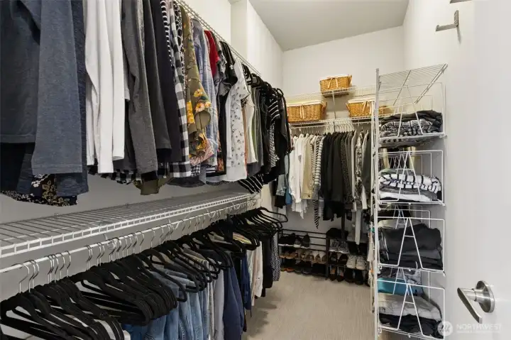 Large walk in closet in second floor primary bedroom.