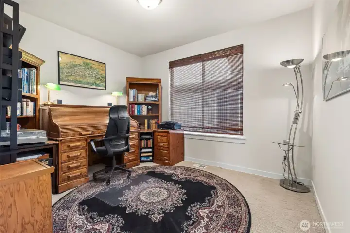 Currently used as an office, the third bedroom offers plenty of room along with ample closet space.