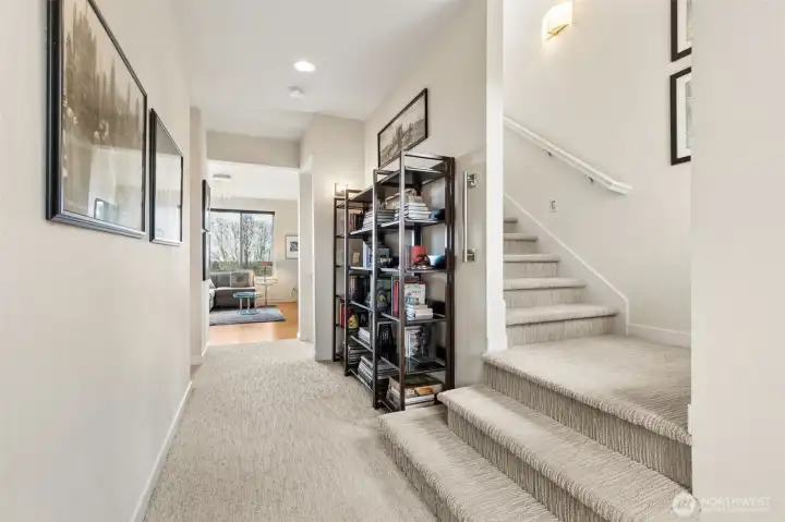 Second floor hallway with the stairs leading up to the 3rd floor loft and roof top deck access. Owners installed wall sconces on both stairways to add extra lighting.