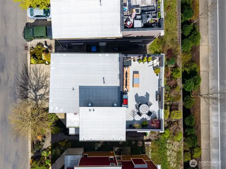 Overhead view shows just how much space the deck provides. Roof is a 50 year membrane roof. Most of the items on the roof stay with the home, so you won't need to worry about moving stuff up there.