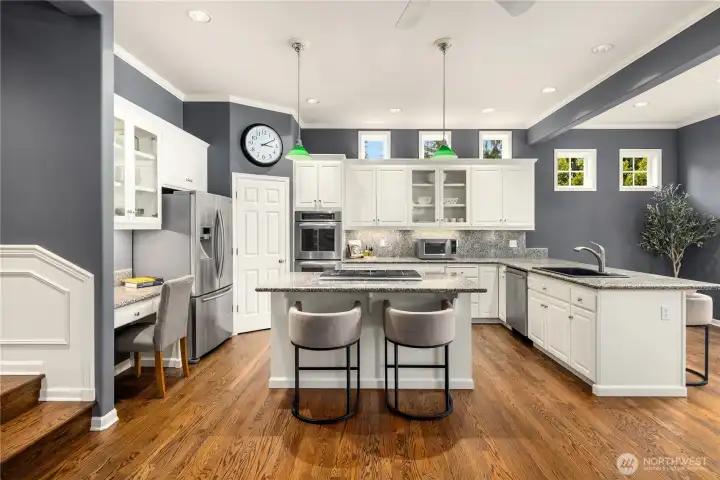 Kitchen with island and multiple areas for dining Kitchen with island and multiple areas for dining