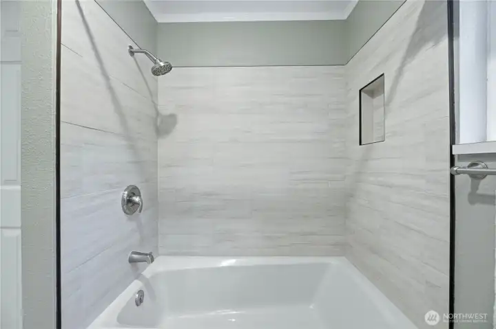 Brand new fully tiled enclosure with new shower head.