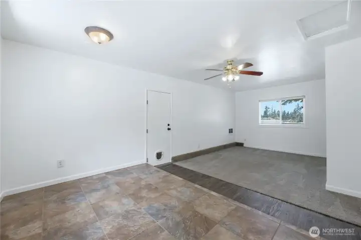 Family room off the dining room. Access to garage converted to storage