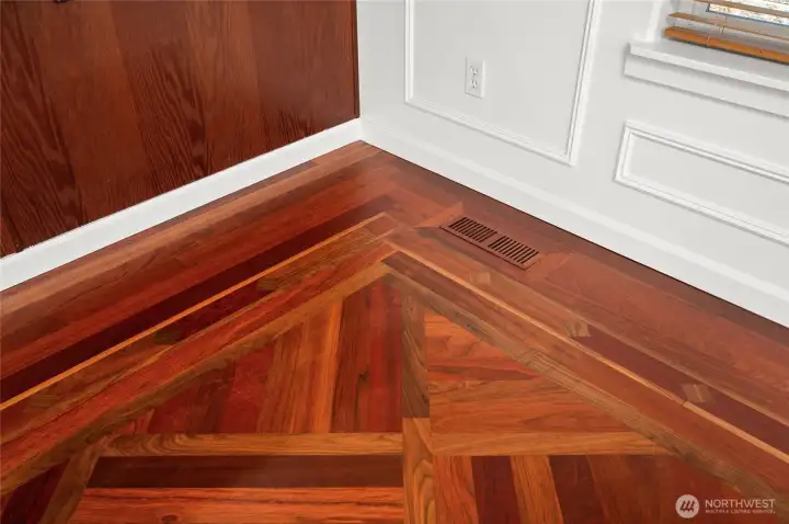 Detail of Brazilian Cherry hardwood floor in dining room.