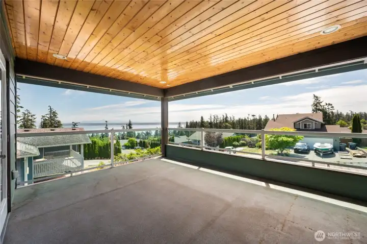View of the covered balcony on the upper level.