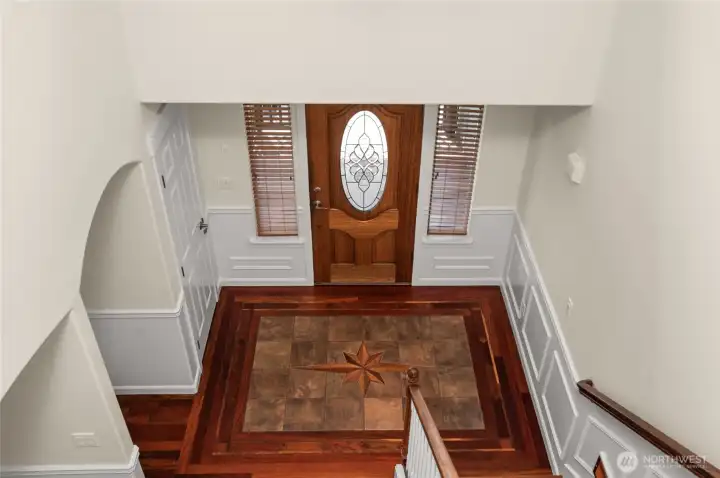 Looking down at the front entry from the upstairs landing.