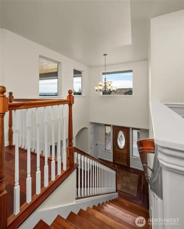 Looking down at the front entry from the upstairs landing.