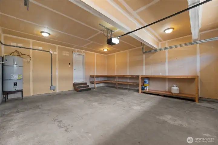 Double car garage with plenty of storage or work space.