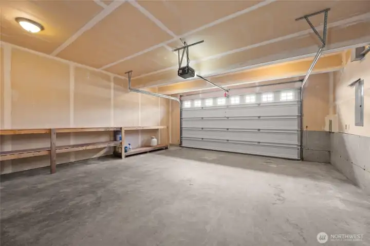 Double car garage with plenty of storage or work space.