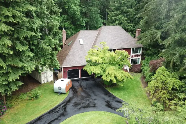 Freshly paved driveway and 40 year Presidential roof