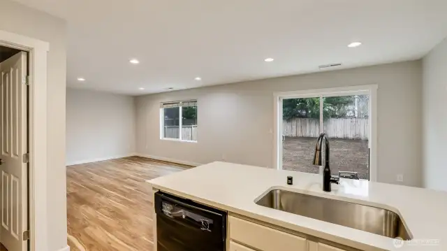 Stay connected to the living and dining areas while cooking or doing dishes, thanks to the home's open and inviting layout.