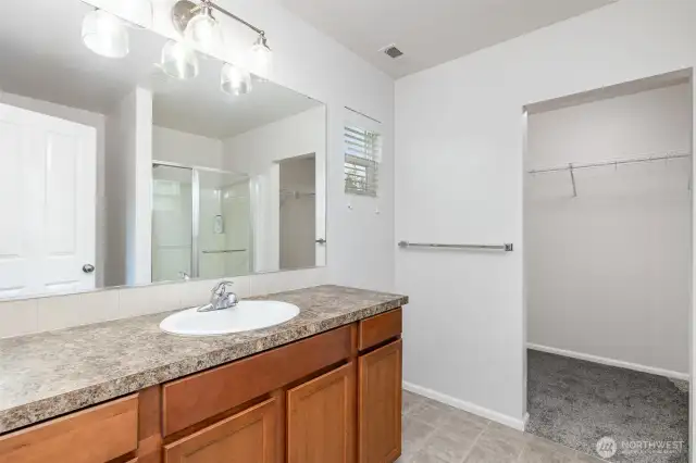 Ensuite features plenty of counter space & cabinet storage.