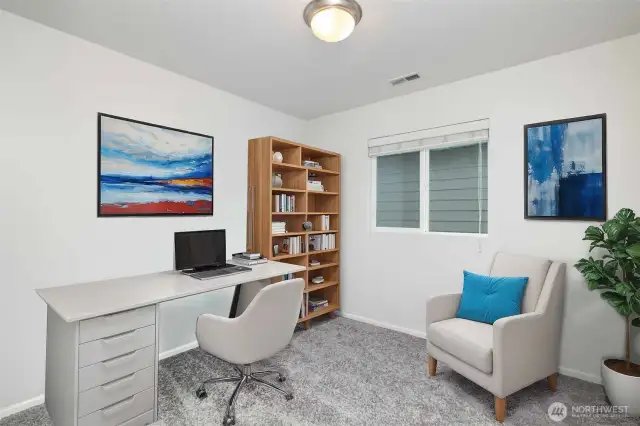 Second upstairs guest bedroom featuring new carpet. -Virtually Staged