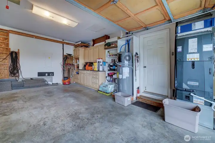 This 2 car garage includes an electric car charger.