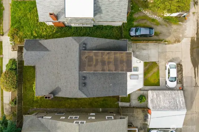 detached garage, and partially fenced yard
