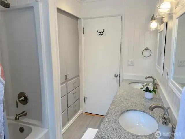 Bathroom on the main floor has built-in cabinets