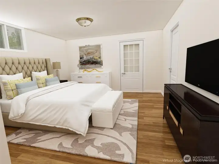 Downstairs bonus room has its own entrance.  This photo is virtually remodeled to show you it as a bedroom.