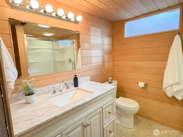 A second warm, beautiful bathroom awaits you on the lower level