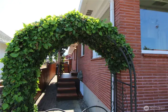 Check out the quaint side entrance to the back yard