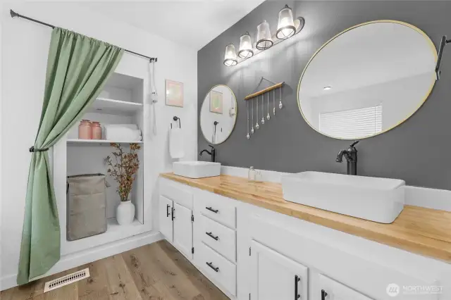 Beautifully redone primary suite with soaking tub and storage