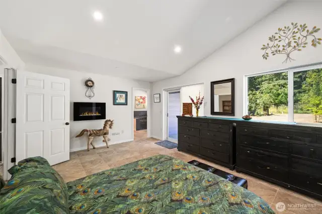 Primary bedroom with fireplace, large walk-in closet and ensuite bathroom