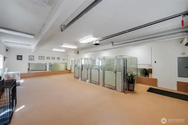 Expansive flex space, currently used as dog boarding room, kennels can be included in the sale.
