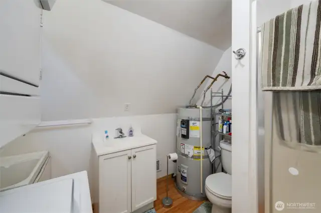 ADU bathroom with washer and dryer