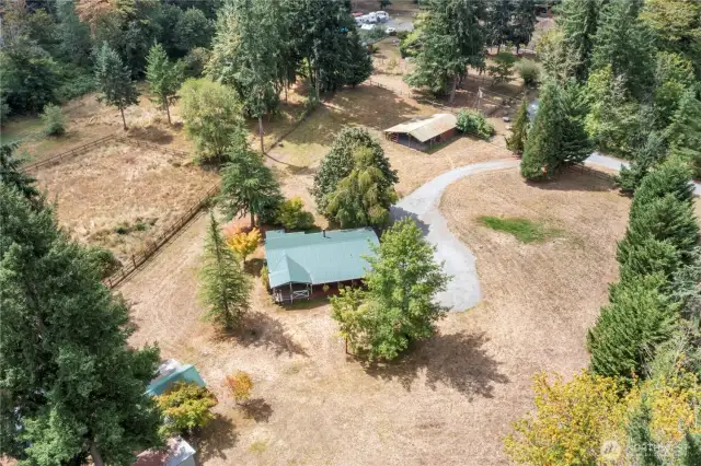 Prime property in excellent location!  Barn at the top of the photo used to house horses. Home in the center!
