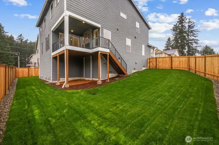 Large landscaped and fenced yard