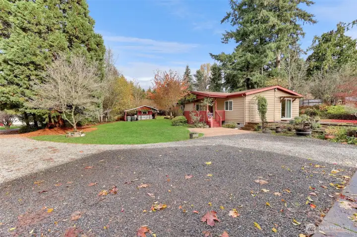 Large gravel driveway can accommodate all your vehicles and toys including RV & boat parking.
