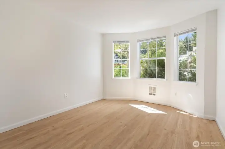 Rest and de-stress in the second of the three bright, comforting bedrooms. All three bedrooms have fresh paint and new flooring.