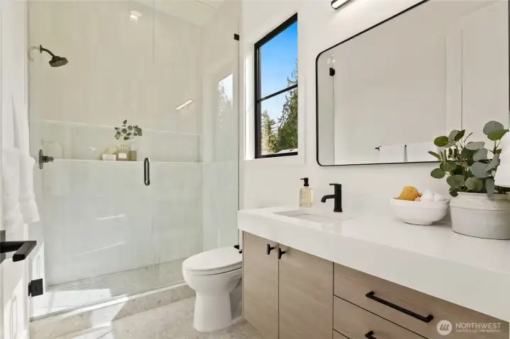 Luxe bath with glass "wall" shower w/ full length shelf for Entry Level Private Suite