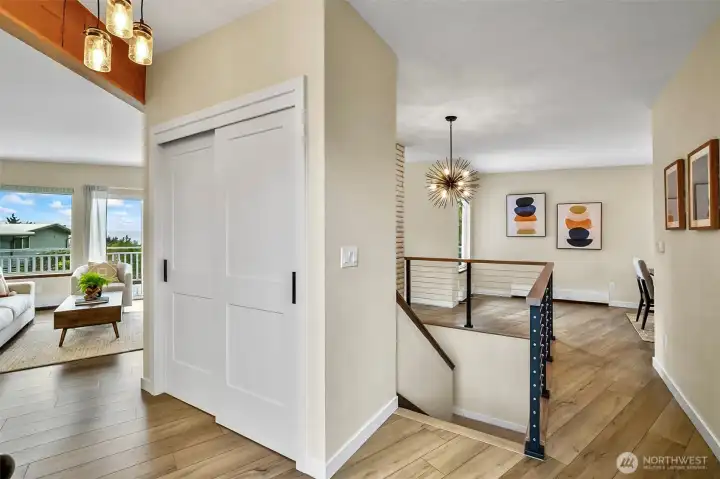 Bright And Welcoming Entry With Vaulted Ceilings Create An Open And Inviting First Impression.