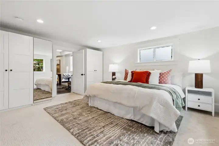 This bedroom is 224 square feet with double closet organizers and new carpet. It also has a separate exit to the yard.
